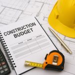 Construction project budget analysis with charts, documents, and financial planning tools