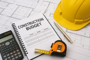 Construction project budget analysis with charts, documents, and financial planning tools